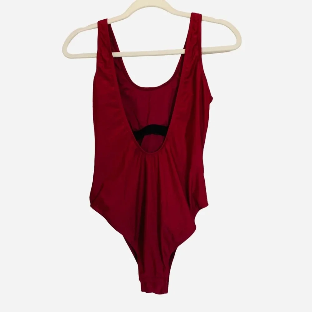 bebe | NWT size medium Burgandy low back one piece swimsuit with rhinestones